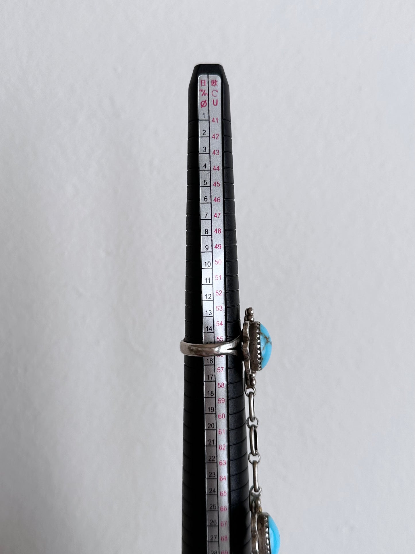 An artisan silver turquoise slave bracelet