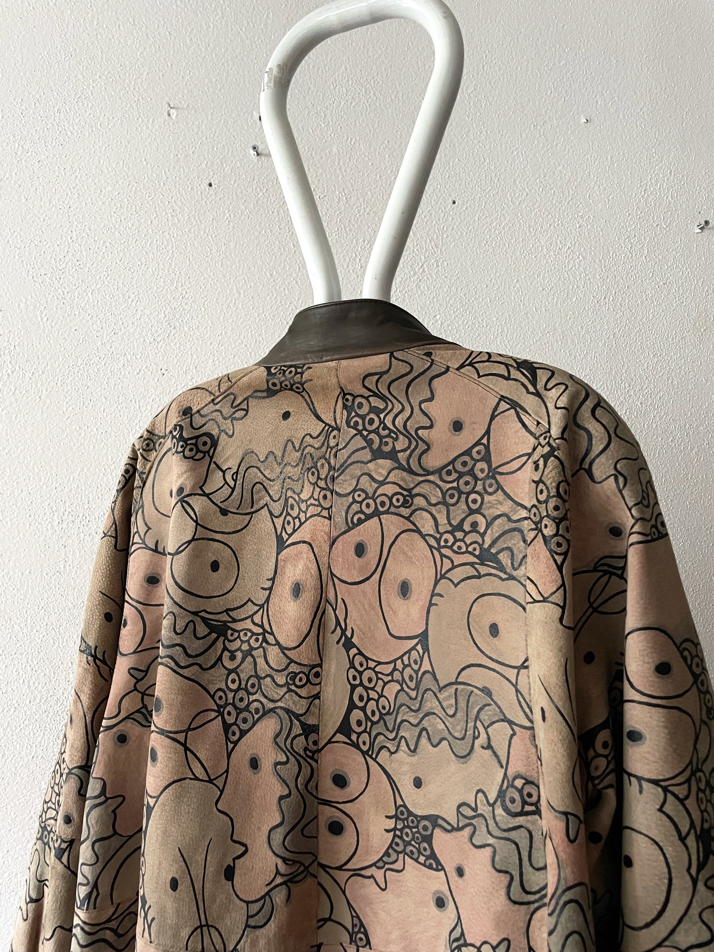 all face pattern leather coat