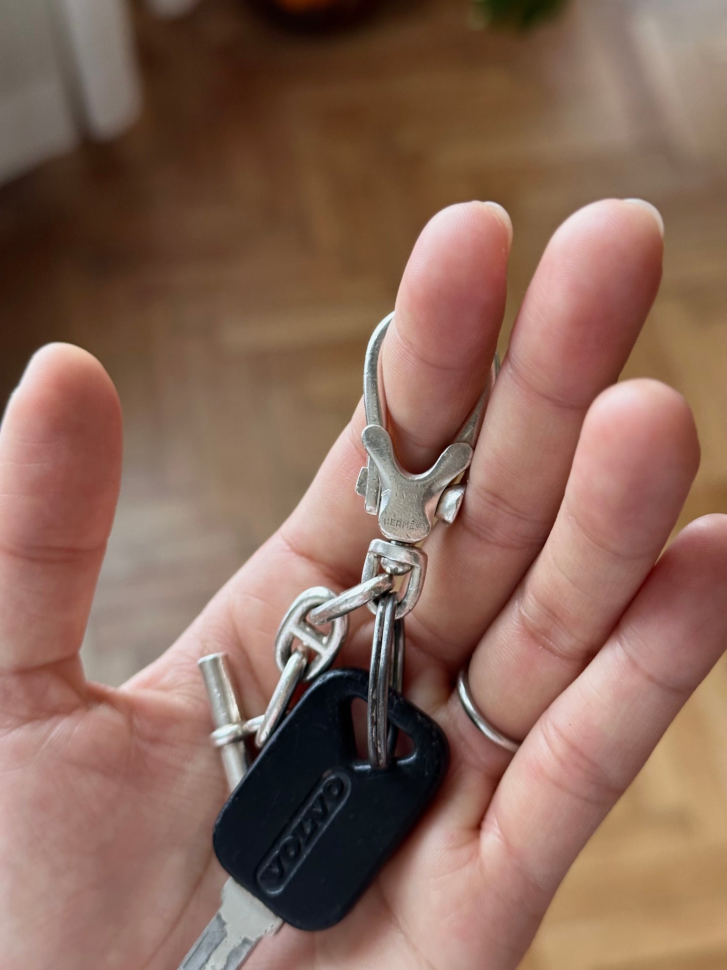 vintage silver keyring with old volvo car key