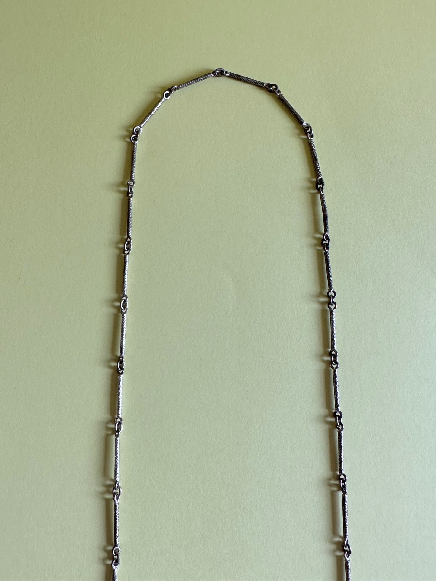 metal opera necklace