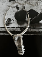 Brushed metal half face necklace