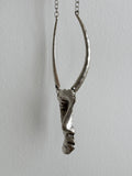 Brushed metal half face necklace