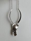 Brushed metal half face necklace