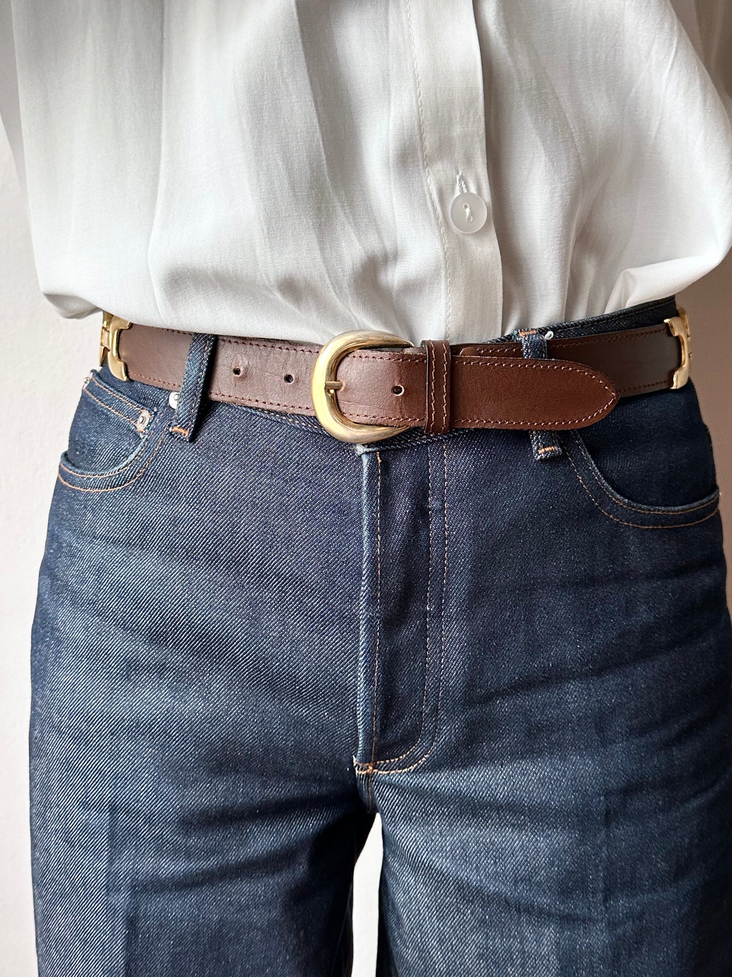 brown leather belt with gold buckle