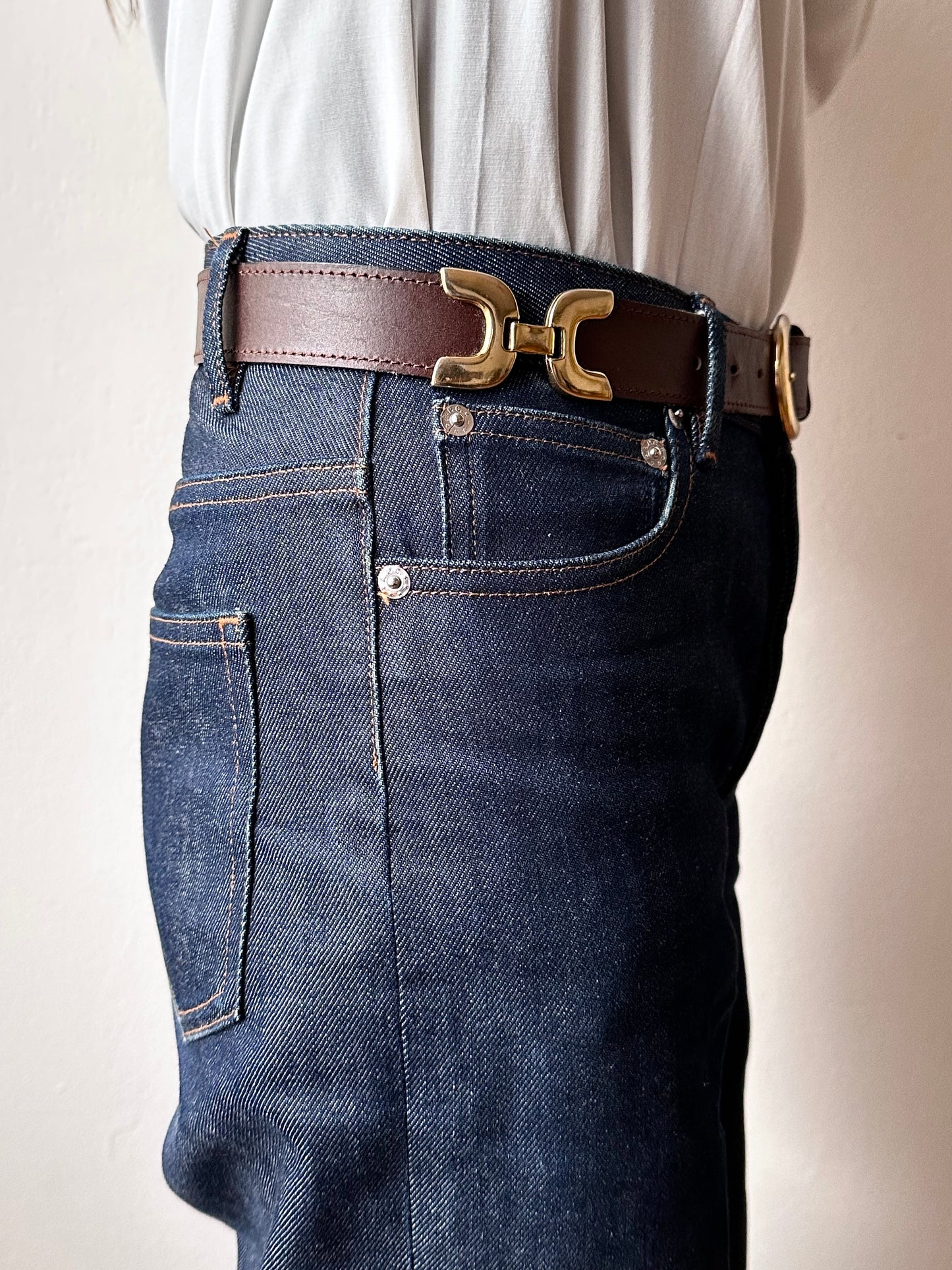 brown leather belt with gold buckle