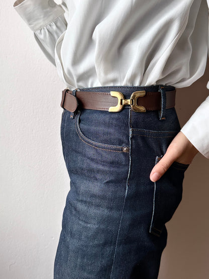 brown leather belt with gold buckle