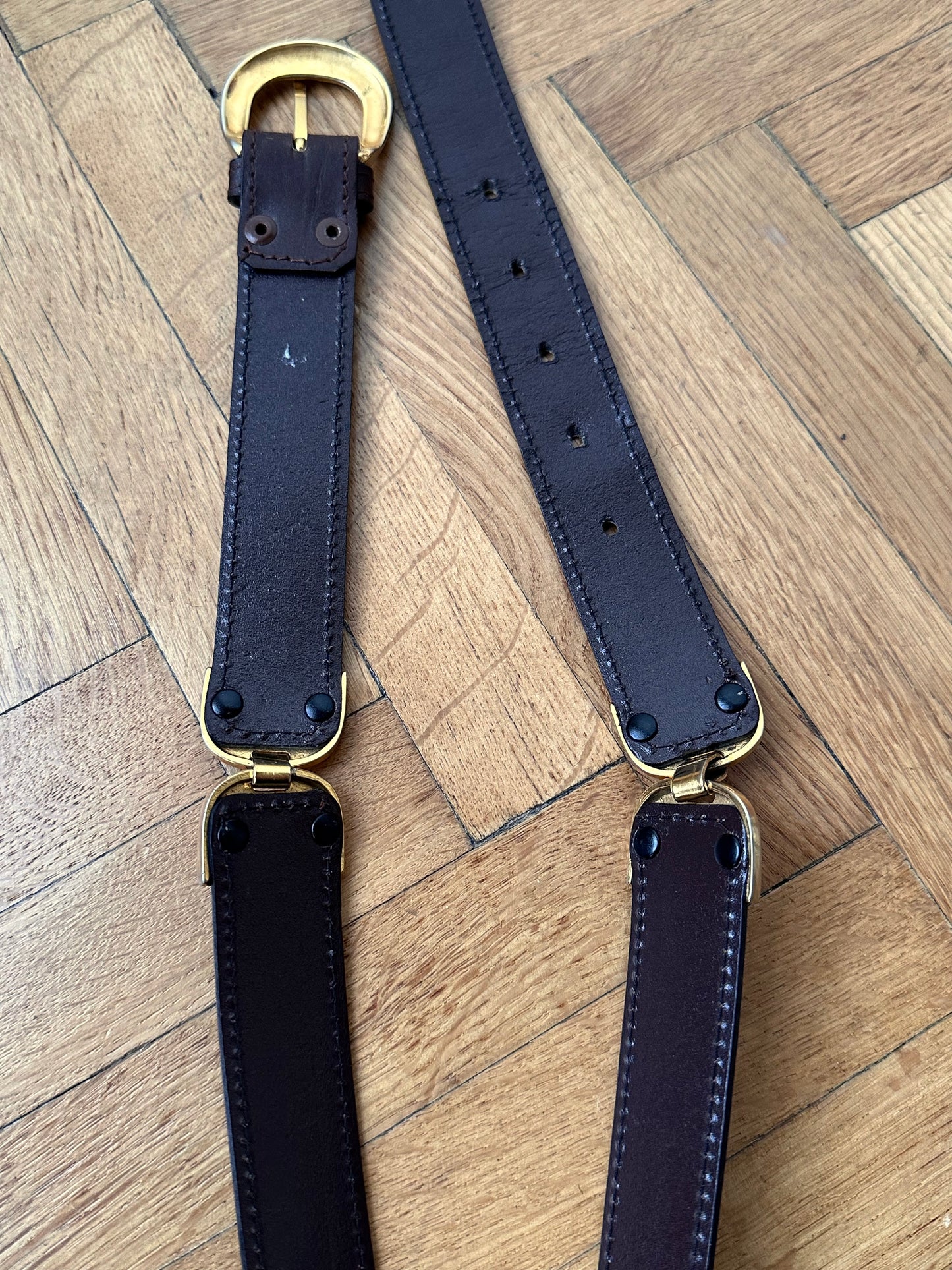 brown leather belt with gold buckle