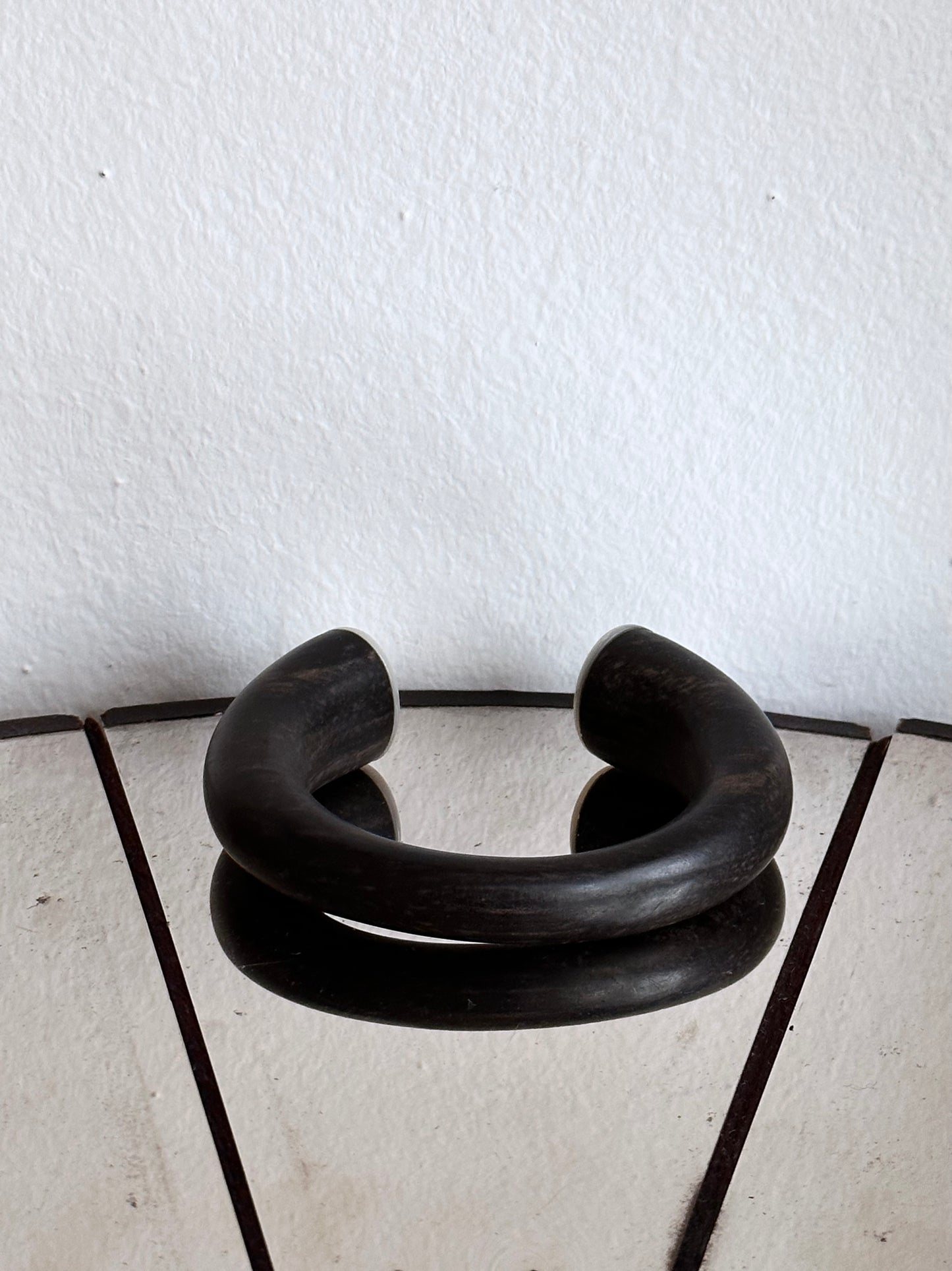black wooden and mother of pearl bangle