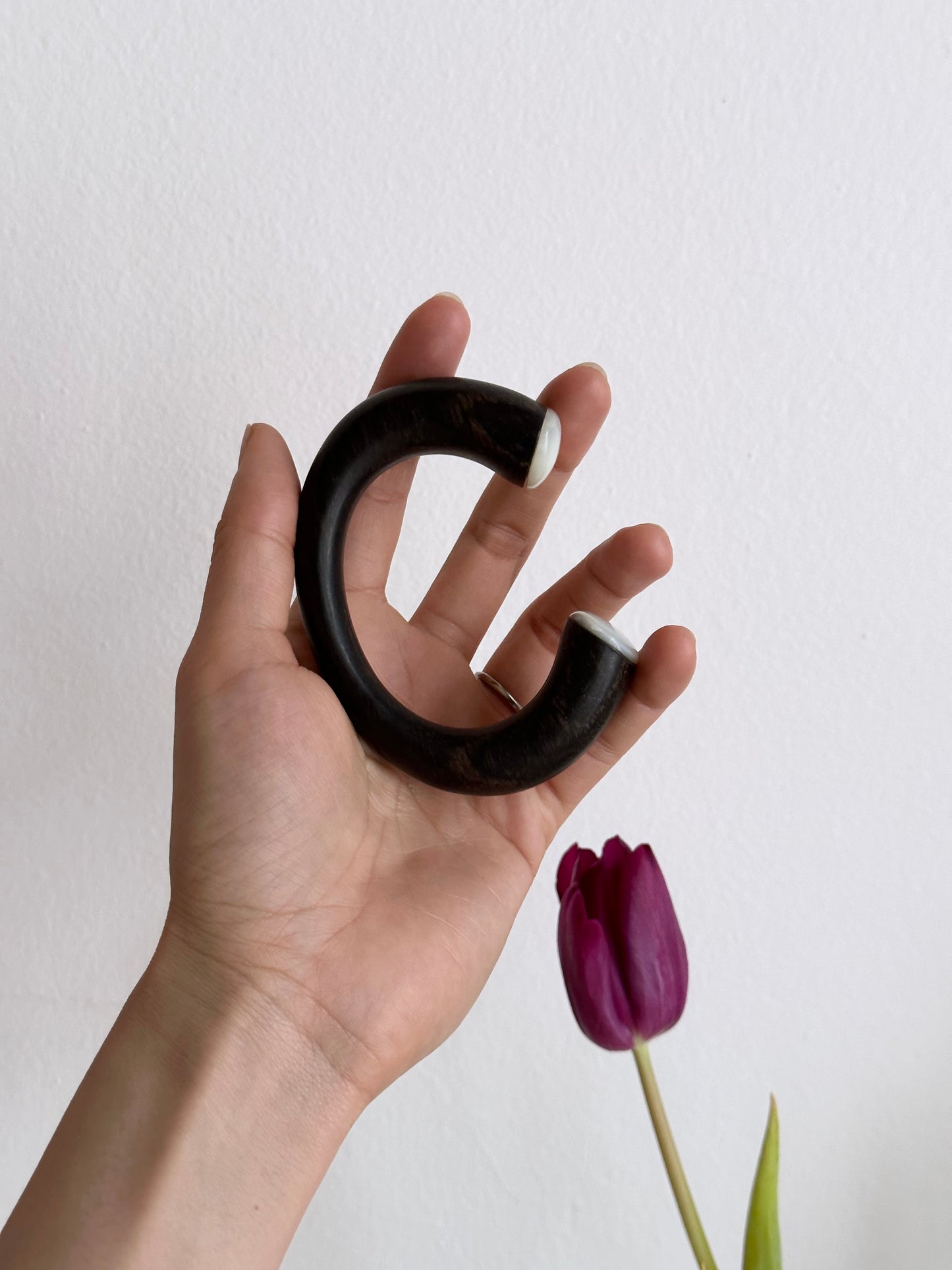 black wooden and mother of pearl bangle