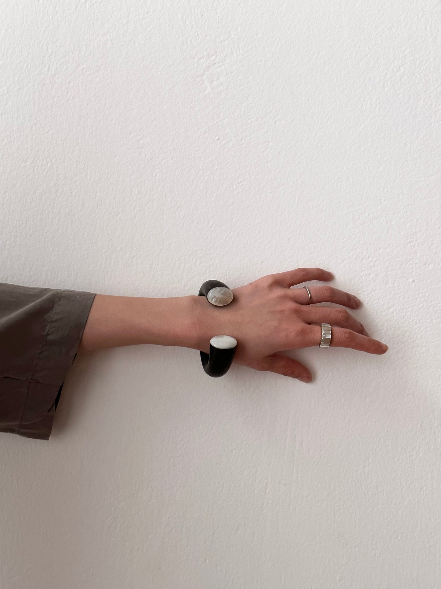 black wooden and mother of pearl bangle