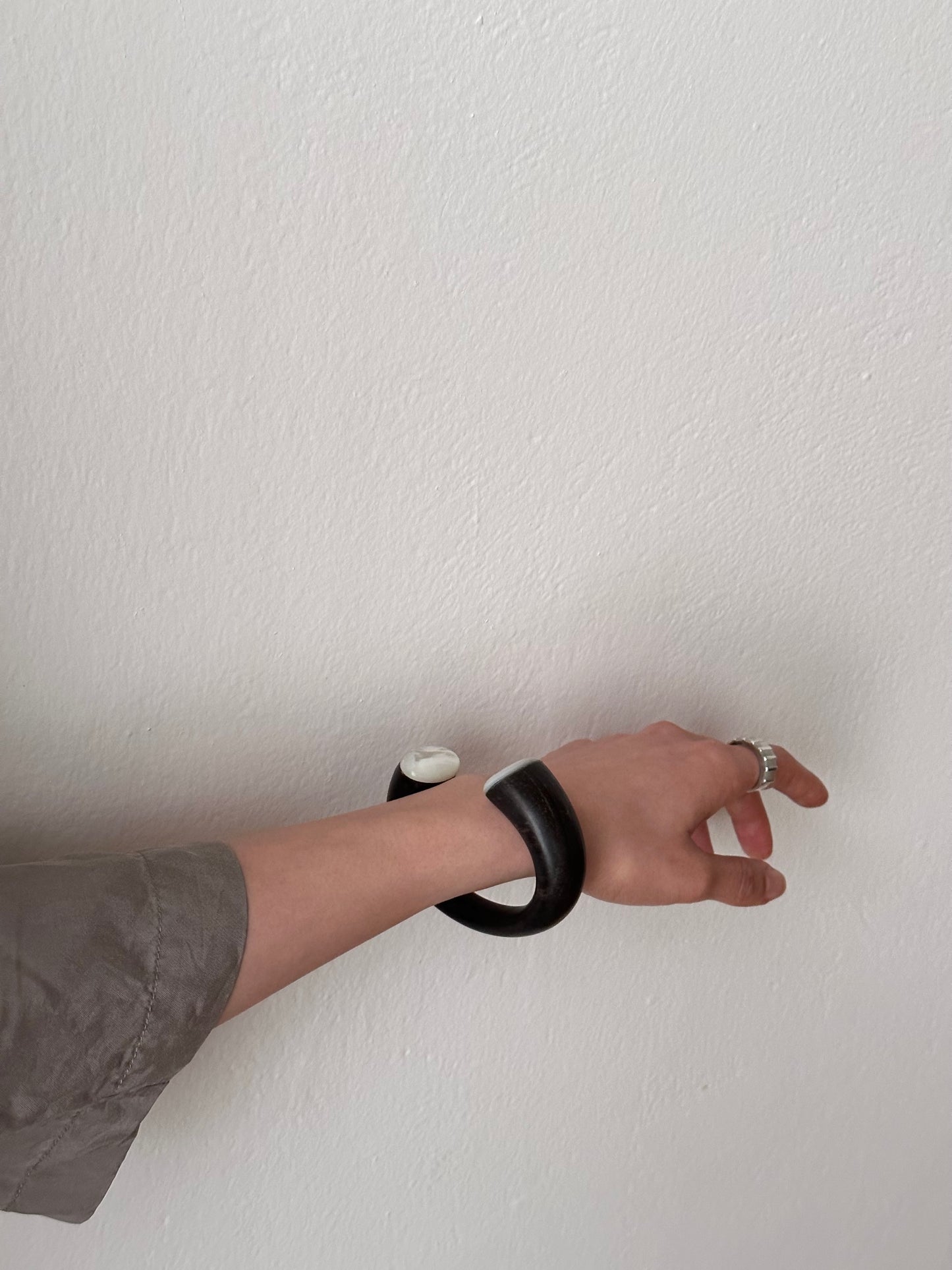 black wooden and mother of pearl bangle