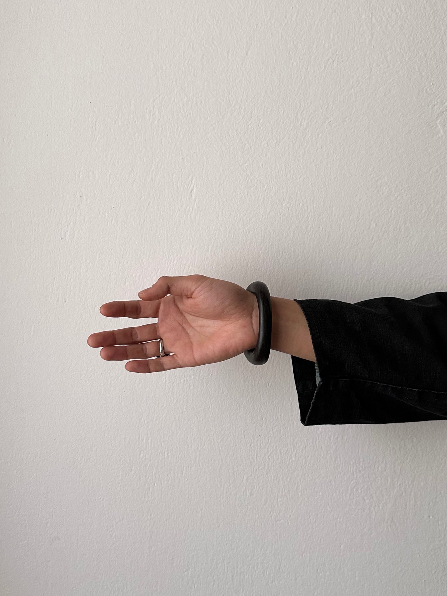 black wooden and mother of pearl bangle