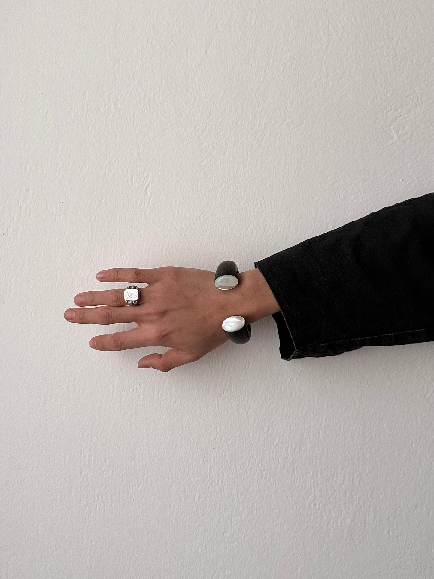 black wooden and mother of pearl bangle