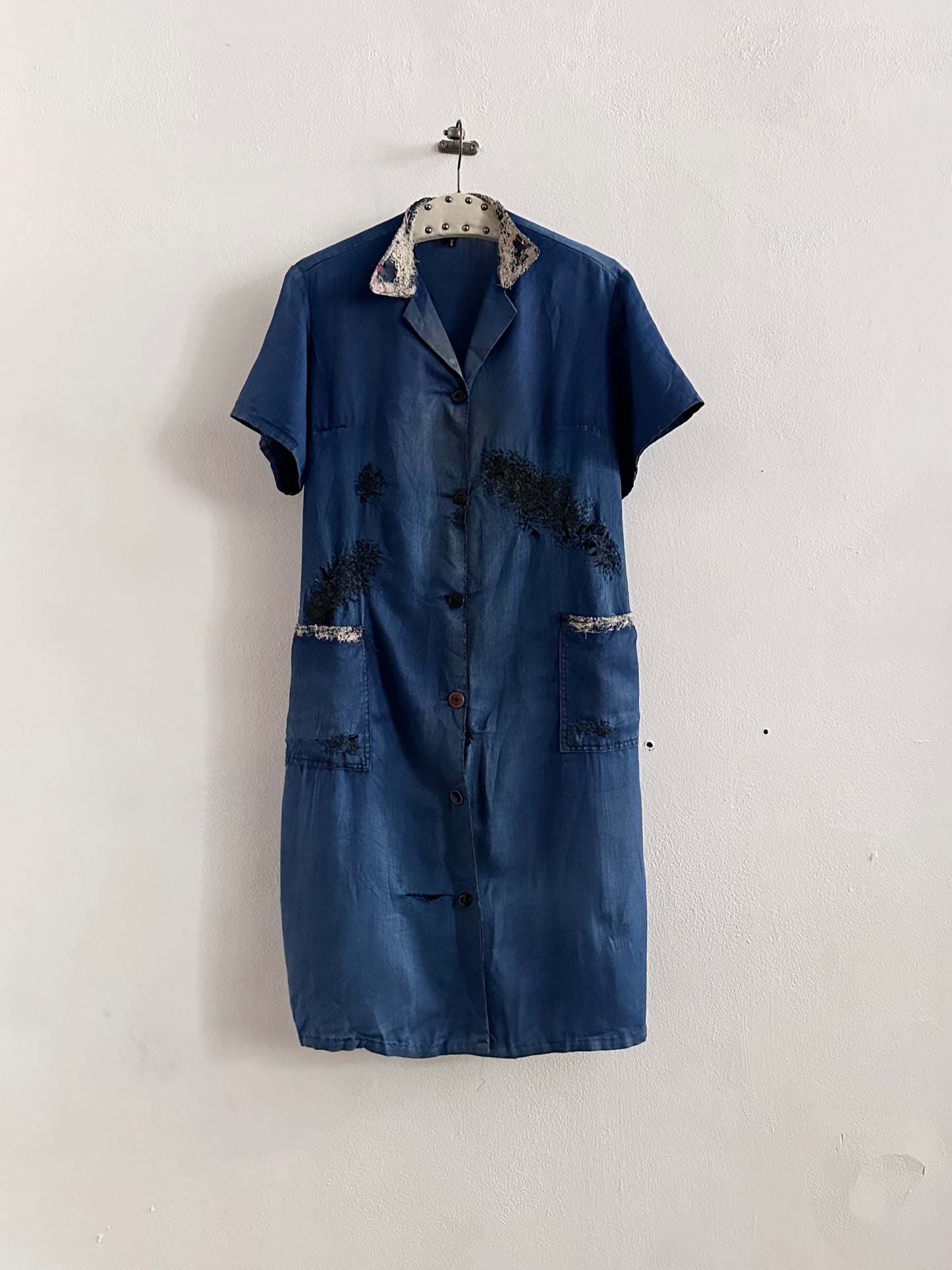 A work shirt with chaotic repairs