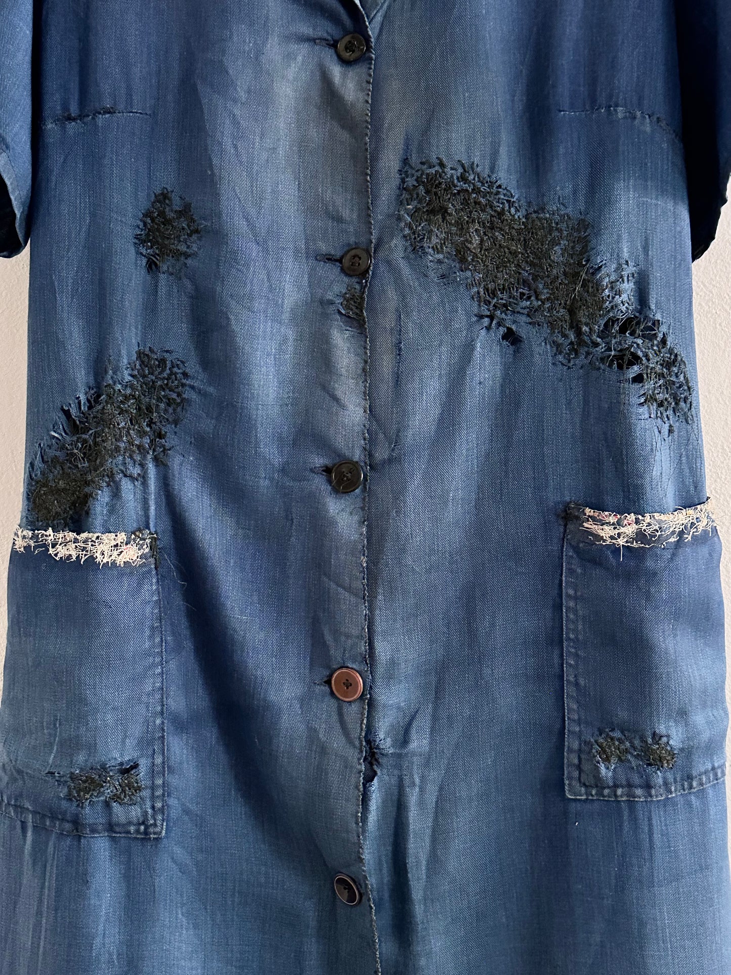 A work shirt with chaotic repairs