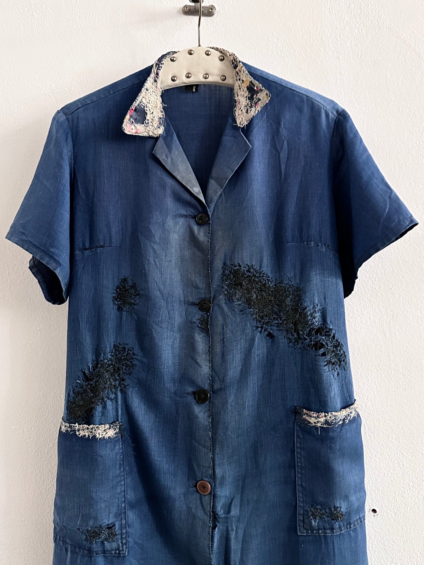 A work shirt with chaotic repairs