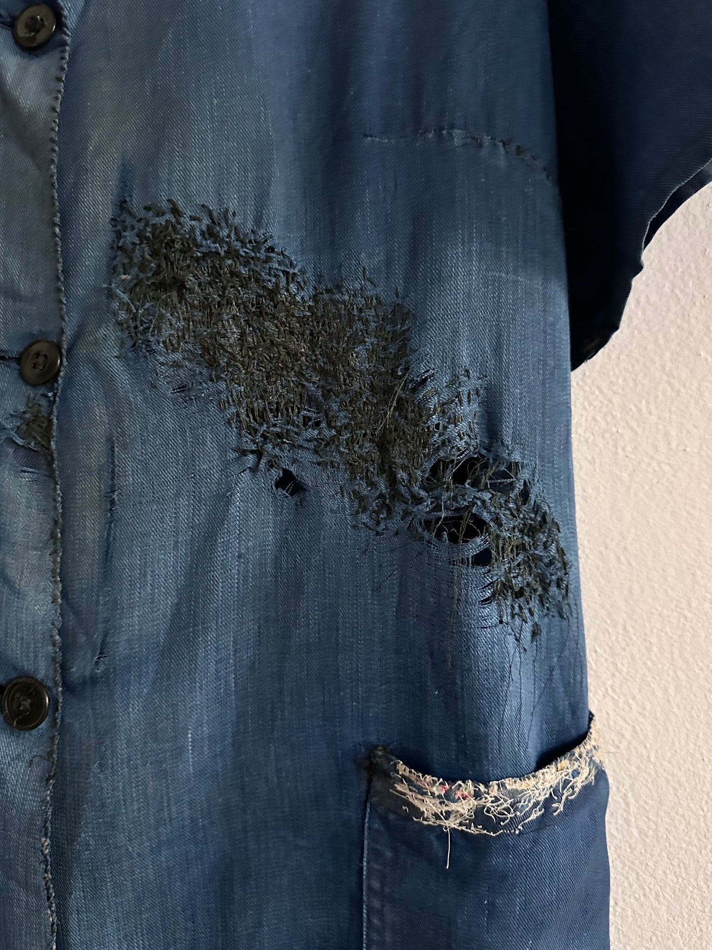 A work shirt with chaotic repairs