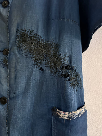 A work shirt with chaotic repairs
