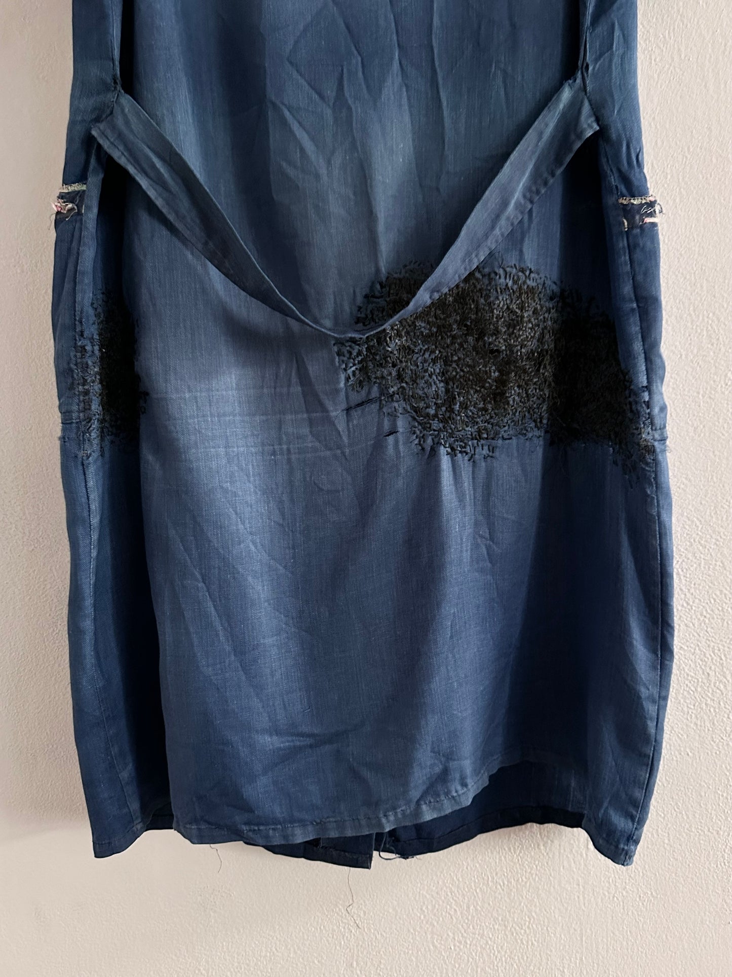 A work shirt with chaotic repairs