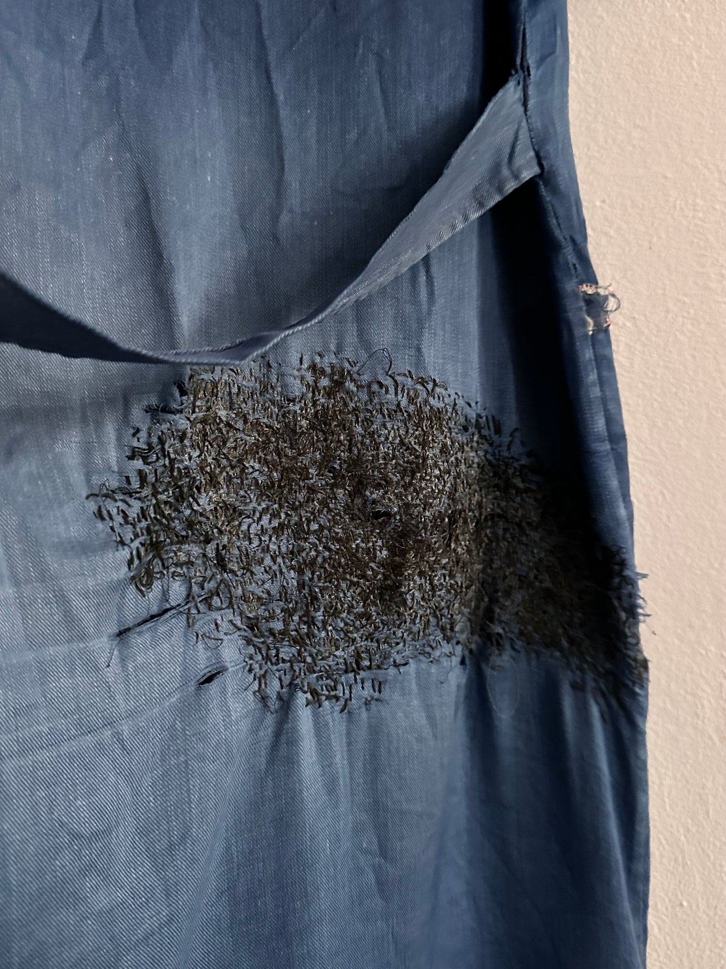 A work shirt with chaotic repairs