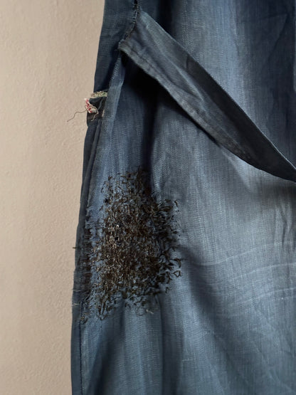 A work shirt with chaotic repairs