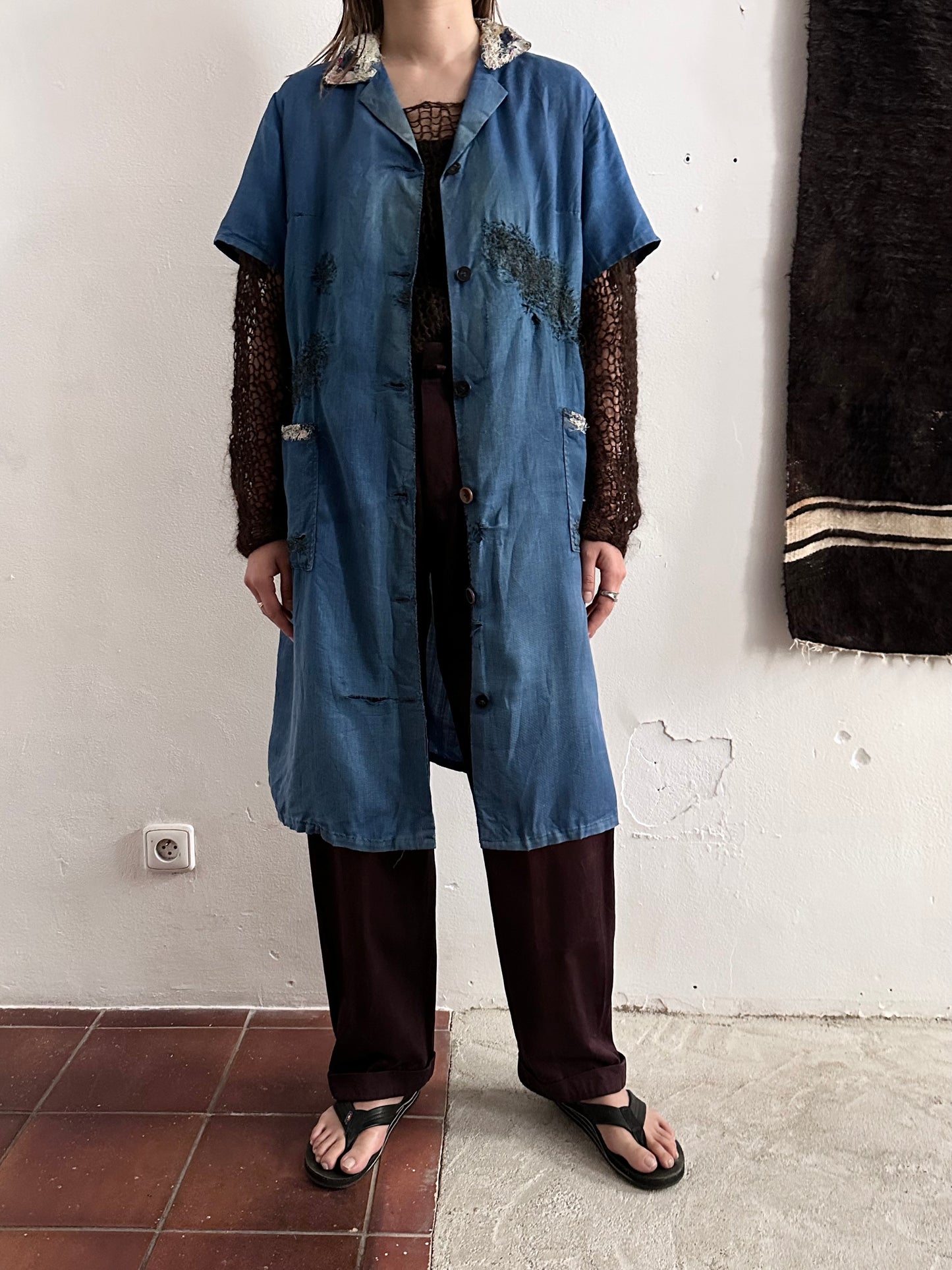 A work shirt with chaotic repairs