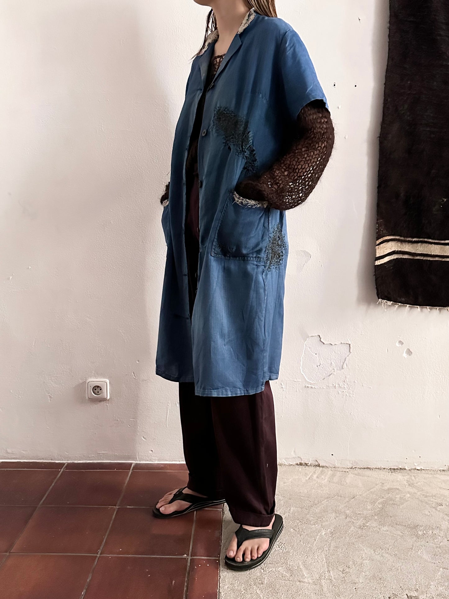 A work shirt with chaotic repairs