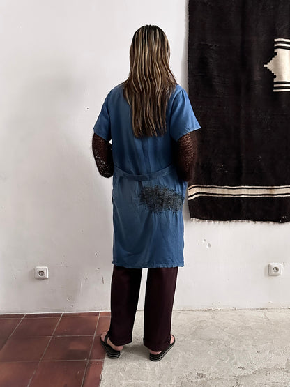 A work shirt with chaotic repairs