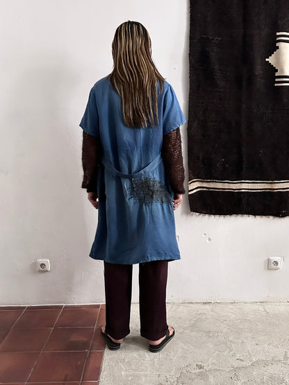 A work shirt with chaotic repairs