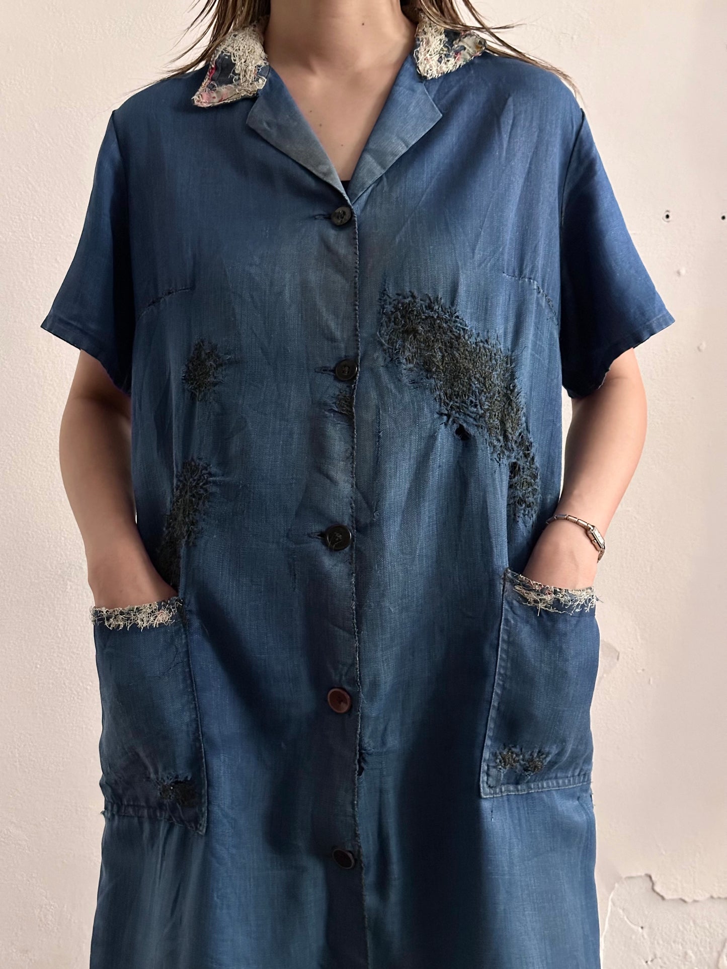 A work shirt with chaotic repairs