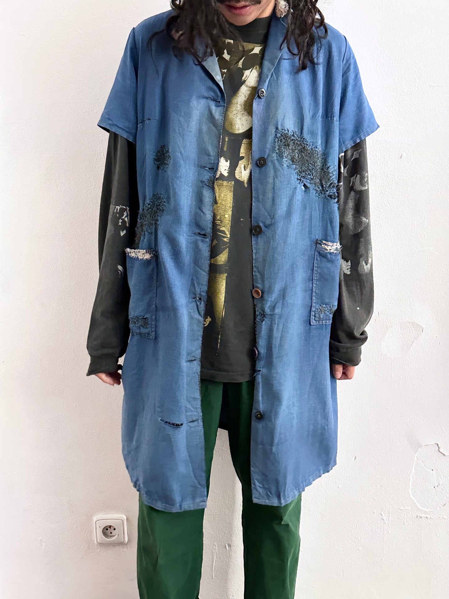 A work shirt with chaotic repairs