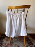 French double tuck white shorts