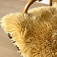 Bright yellow mouton rug