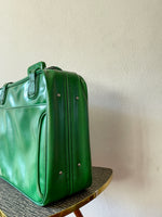 green leather travel bag