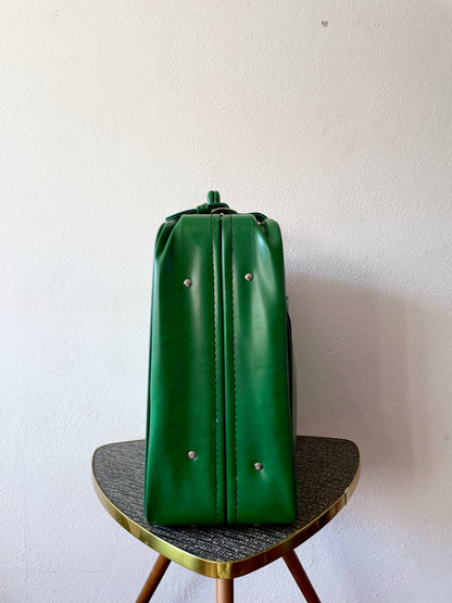 green leather travel bag