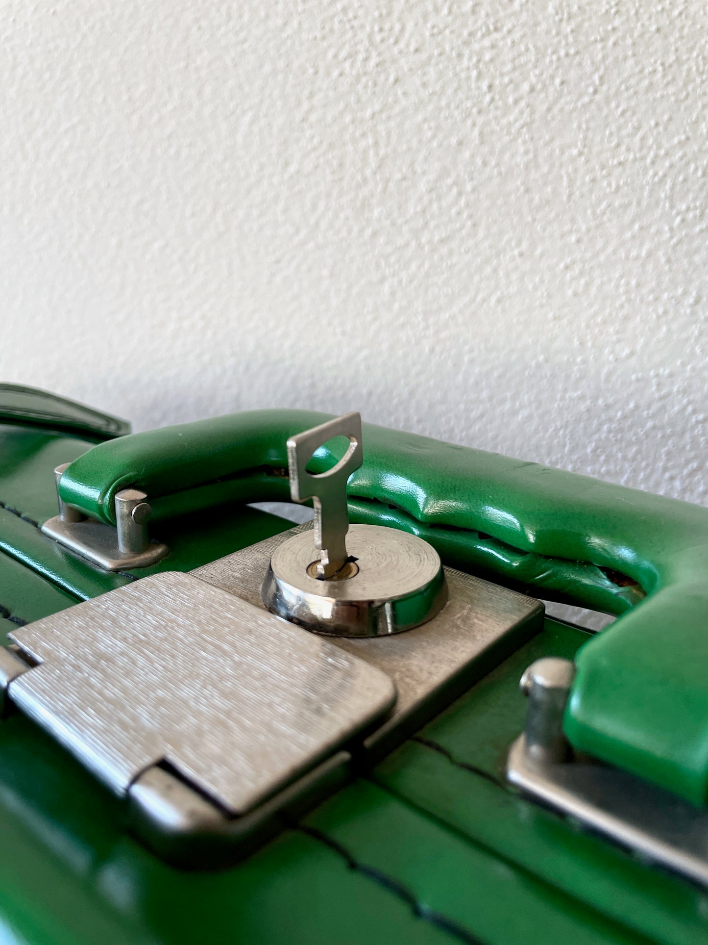 green leather travel bag