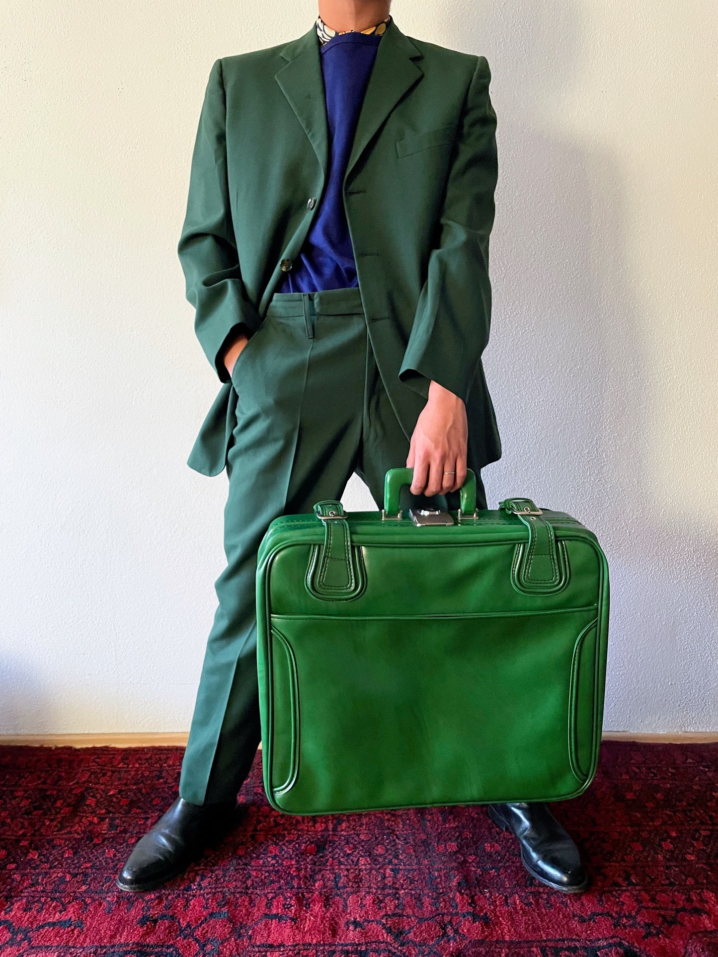 green leather travel bag