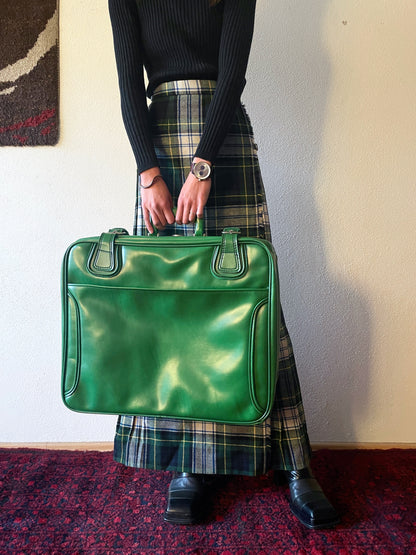 green leather travel bag